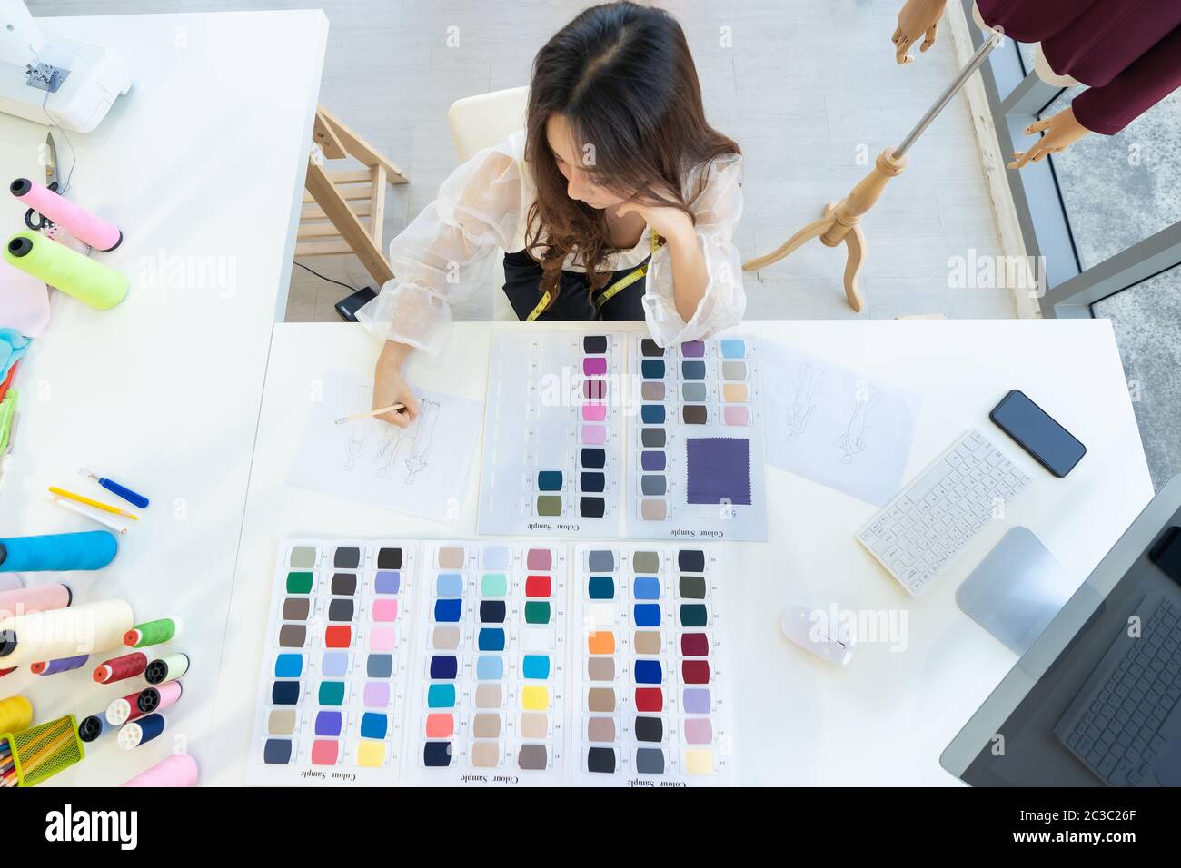 Fashion designer owner sketching Stock Photo