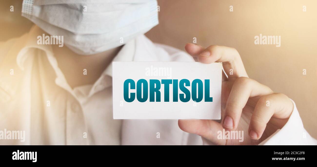 Doctor's Hand with white card with Cortisol word. Immune System Healthcare medical Concept Stock Photo