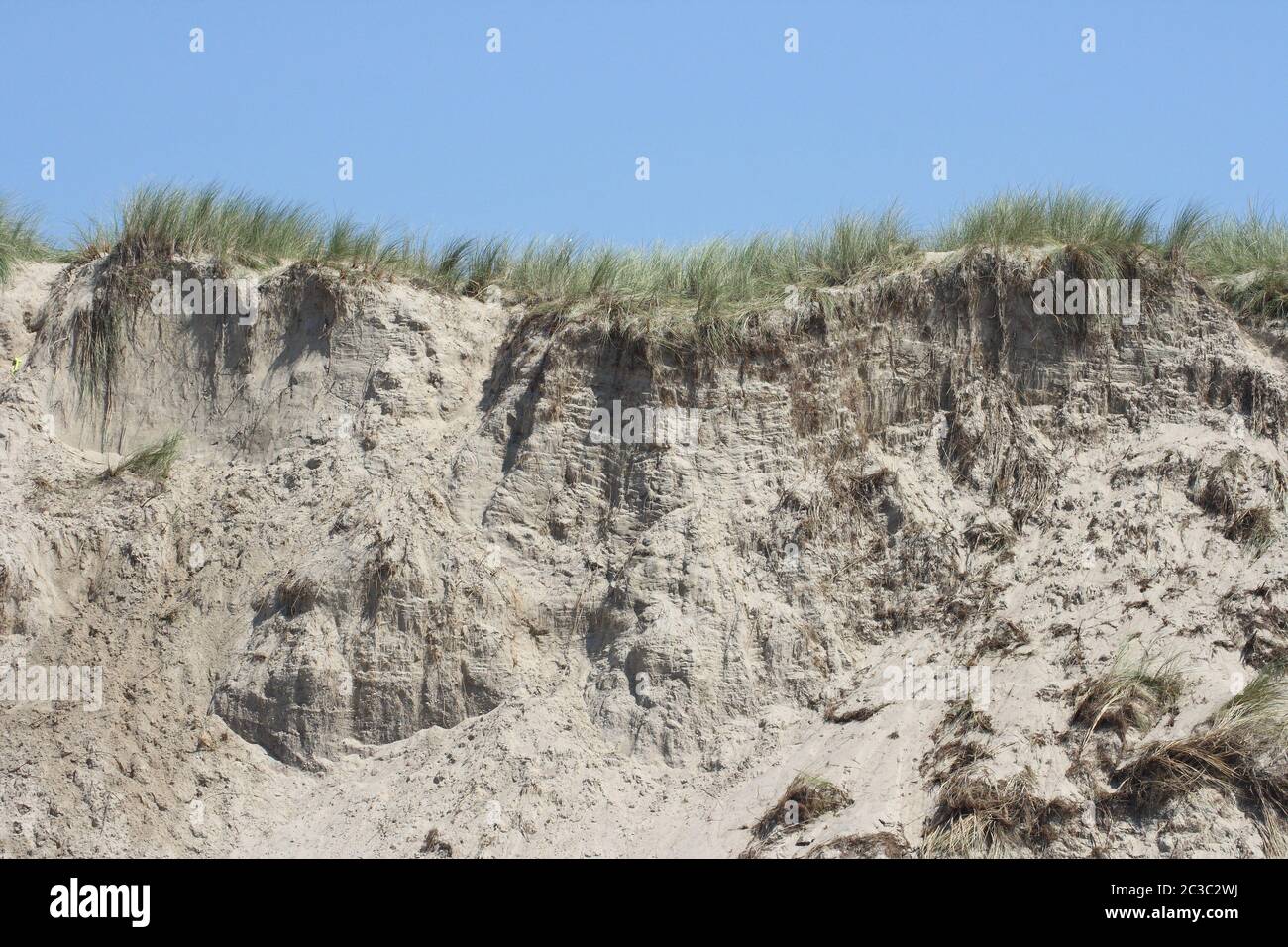 a sandy cliff on the sea coast Stock Photo
