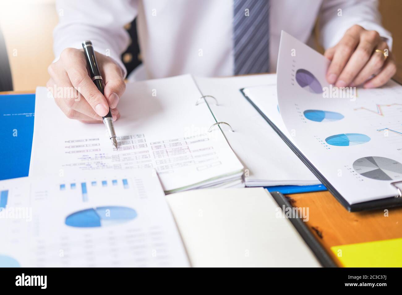 Business team data analyzing income charts document during discussion ...