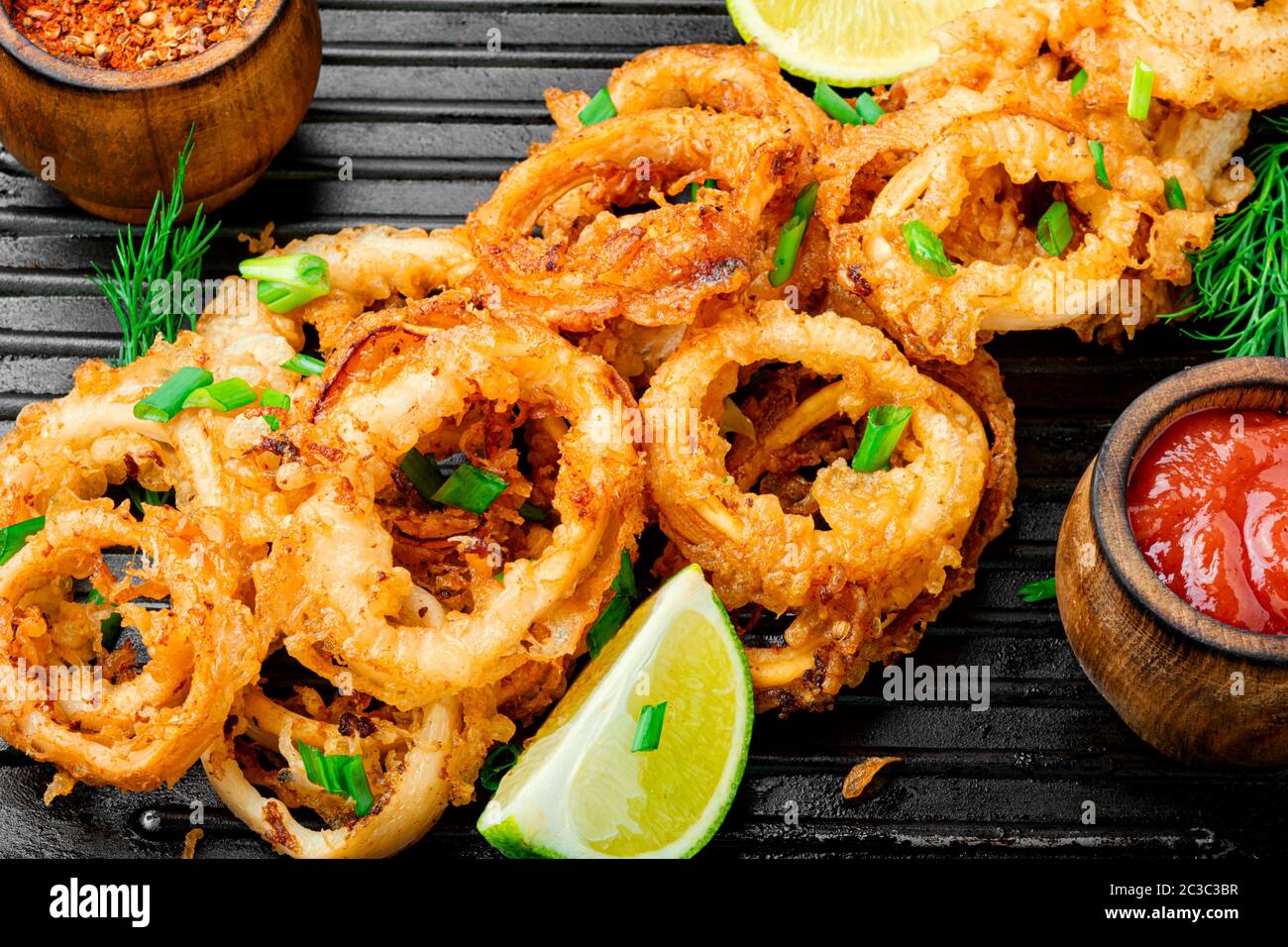 Fried rings of squid in the frying pan Stock Photo - Alamy