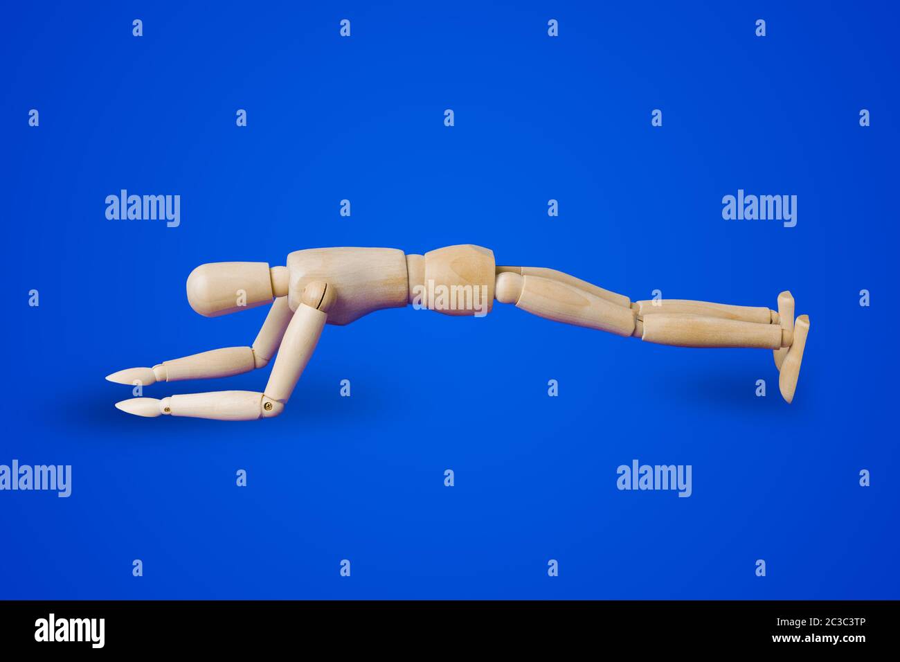 Sports wooden toy figure on blue Stock Photo