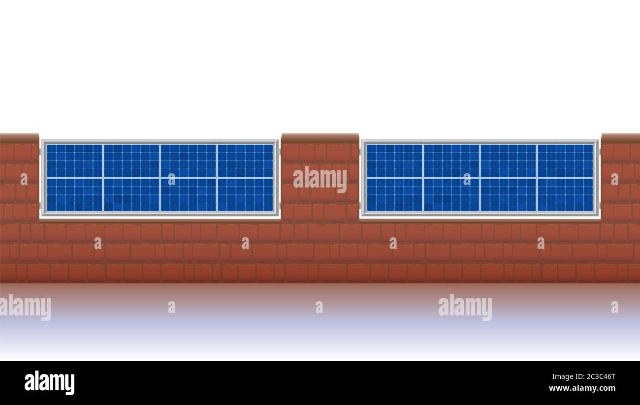 Photovoltaic fence. Solar panels for ecological electricity production. Brick wall with solar plates collector set. Stock Photo