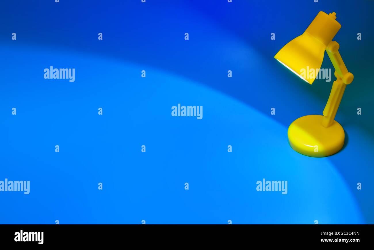 Desk lamp on blue Stock Photo