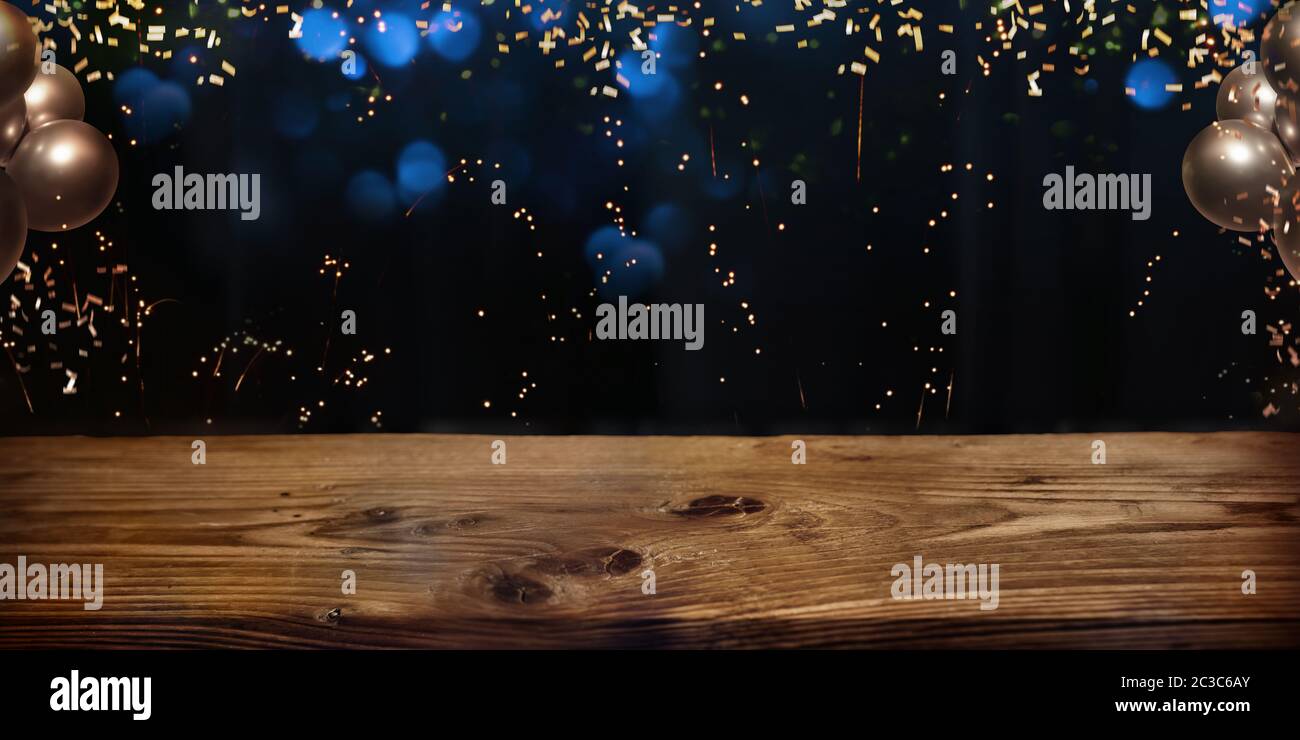 Empty wooden table in front of glamorous background. Decoration for ...