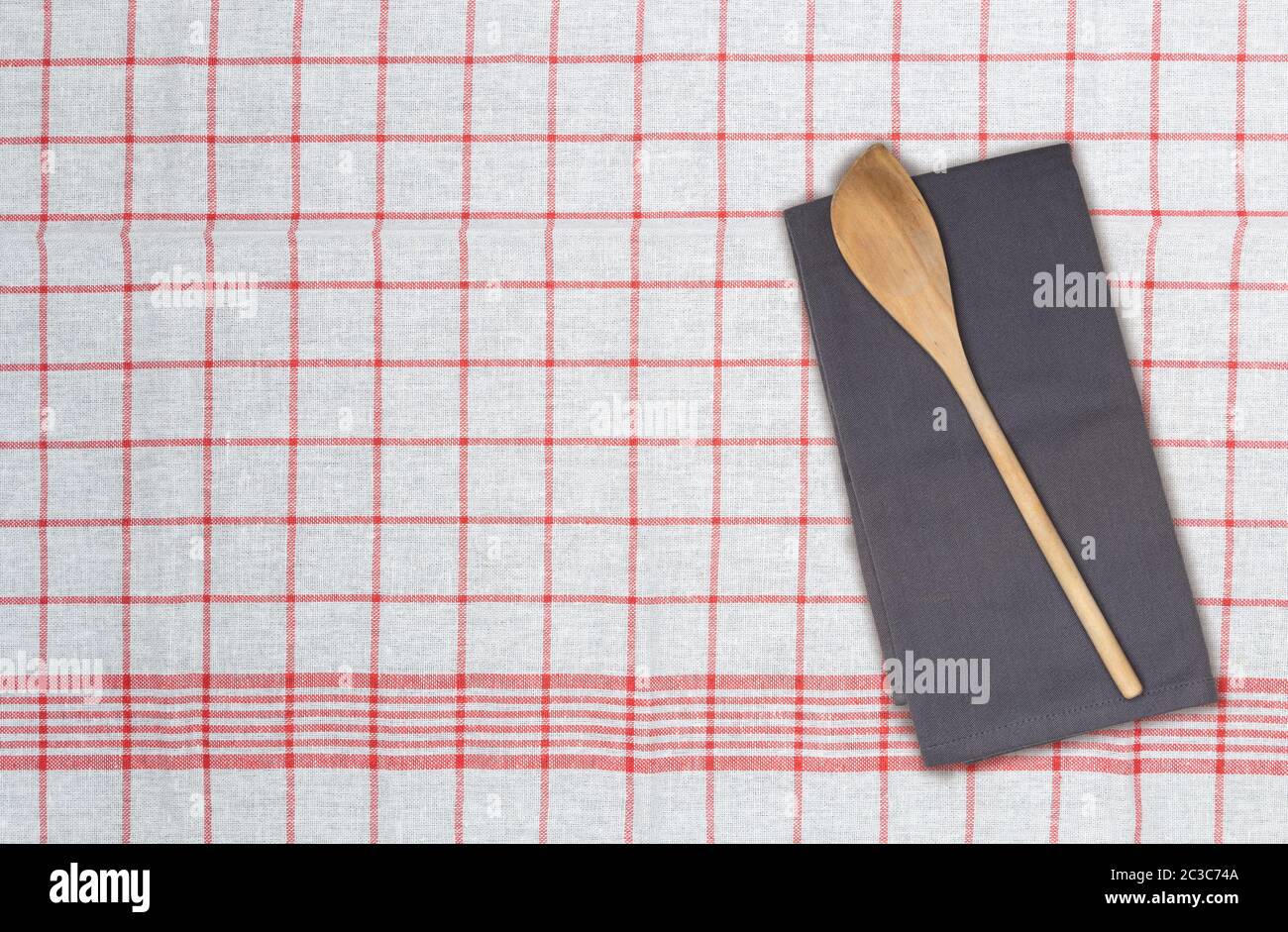 Wooden spoon and kitchen towel concept Stock Photo Alamy
