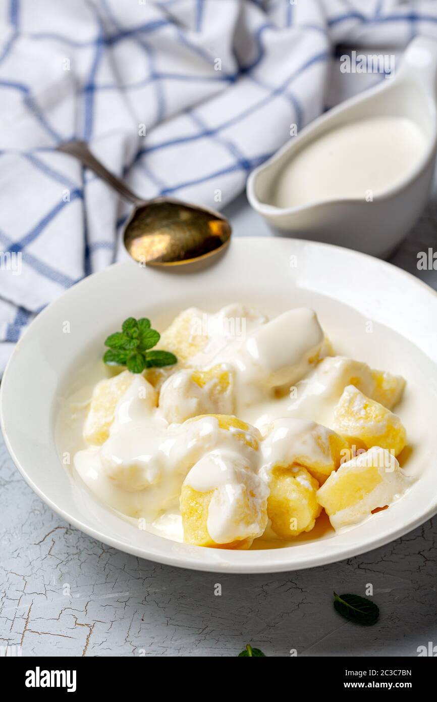 Homemade cottage cheese gnocchi with sour cream sauce Stock Photo Alamy