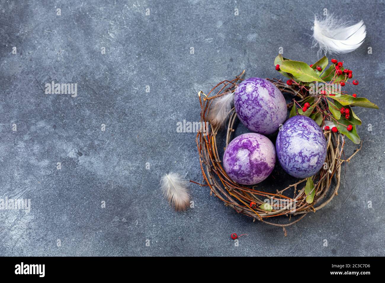 Easter background with painted eggs in nest. Stock Photo