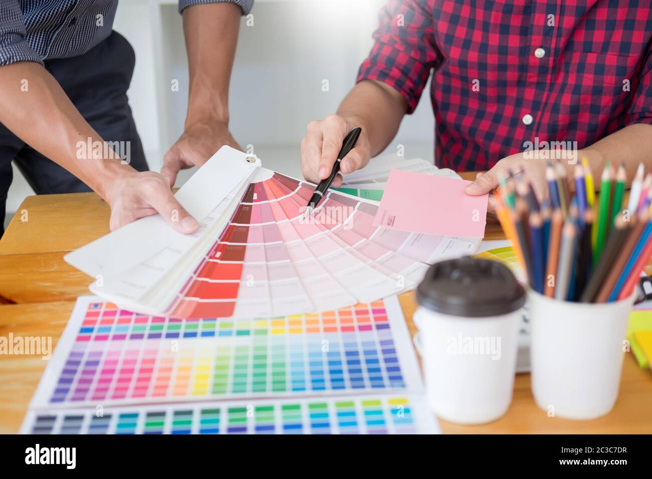 team Web designer working drawing something on graphic computer in the office or studio Stock Photo