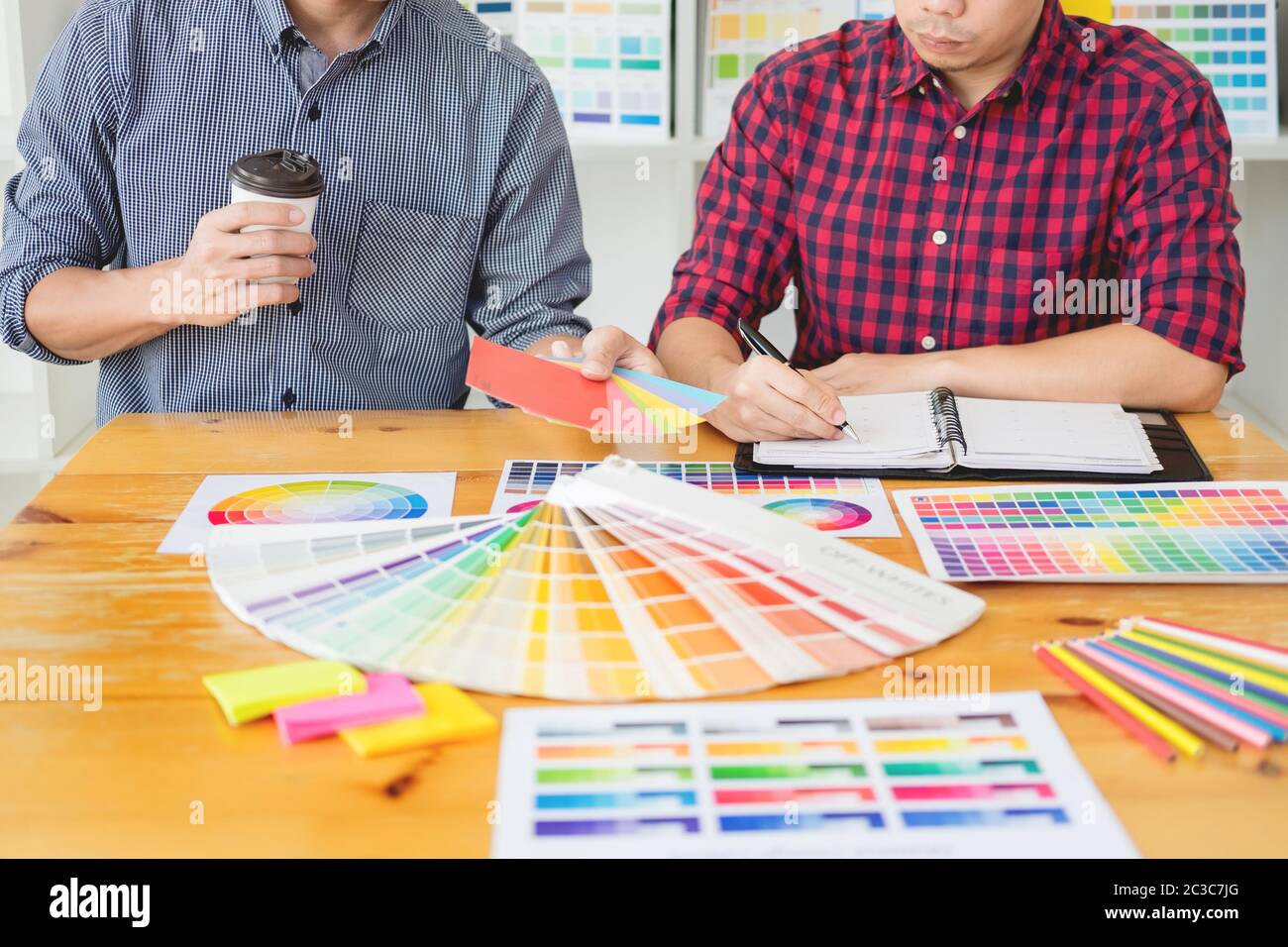 team Web designer working drawing something on graphic computer in the office or studio Stock Photo