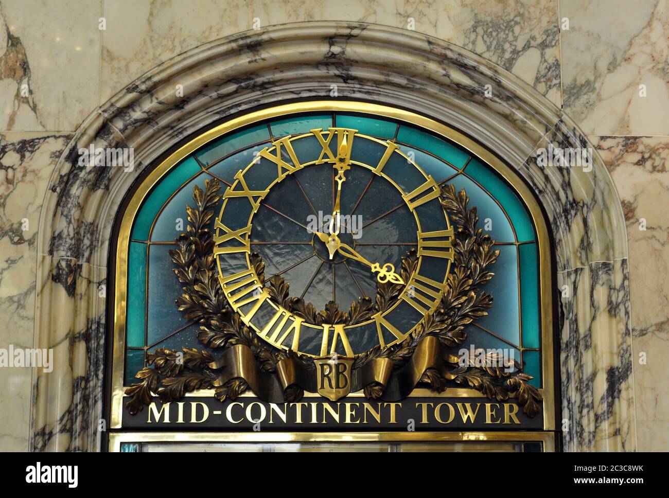 A clock in the lobby of the Mid-Continent Tower in downtown Tulsa, Oklahoma. The original building was completed in 1918, and added onto in 1984. Stock Photo
