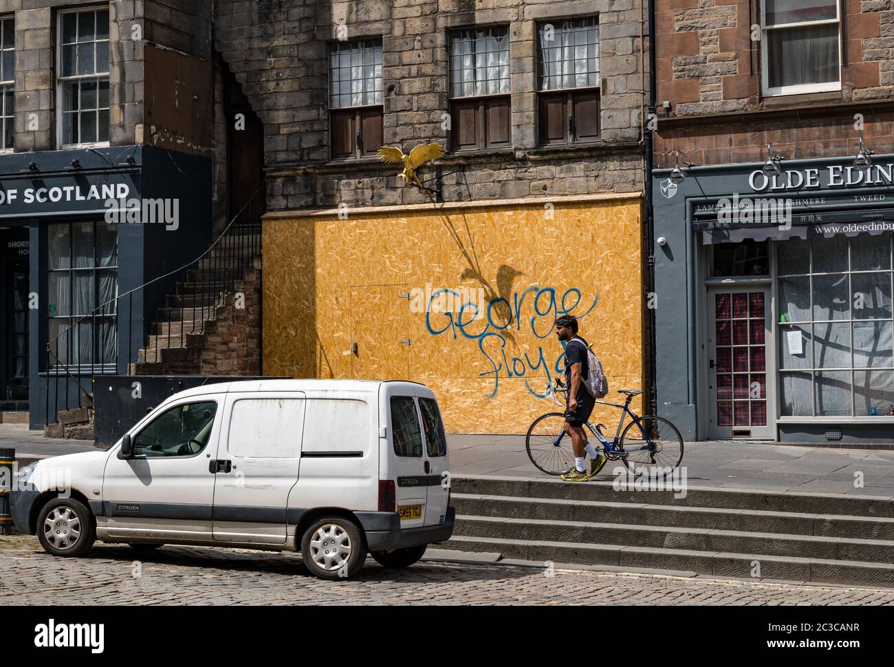 Edinburgh, Scotland, United Kingdom, 19th June 2020. Black Lives Matter Mural Trail: Pictured: George Floyd graffiti on the boarded up historic house Gladstone's Land on the Royal Mile Stock Photo