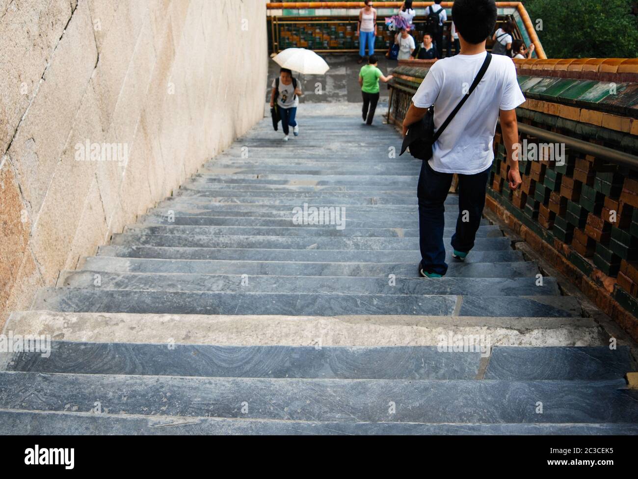 A view of people coming up and down the ancient Chinese stairs in a Summer Palace, Beijing, China Stock Photo