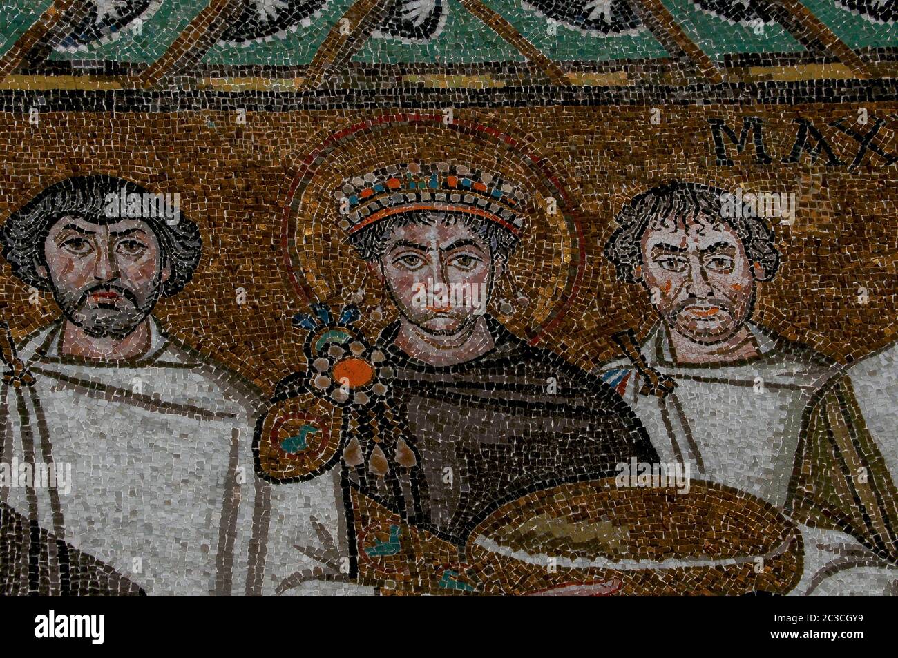Byzantine Emperor Justinian I, also known as Justinian the Great, flanked by members of his retinue.  Byzantine mosaic in the Basilica di San Vitale at Ravenna, Emilia-Romagna, Italy.  The mosaic was created in the 500s AD, a few years after Ravenna was captured by the Byzantine Empire from the Ostrogoths. Stock Photo