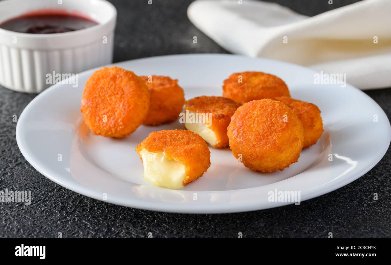 Camembert nuggets with cranberry sauce Stock Photo