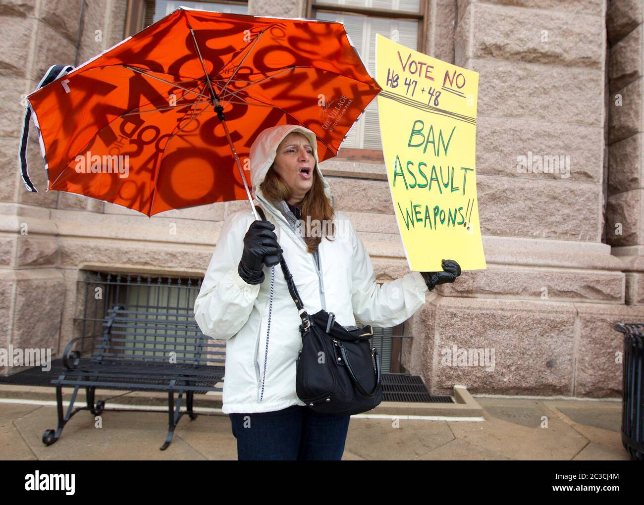 Austin, Texas USA: Anti-gun violence protester stands outside Texas Capitol building with sign saying 'ban assault weapons.' ©Marjorie Kamys Cotera/Daemmrich Photography Stock Photo