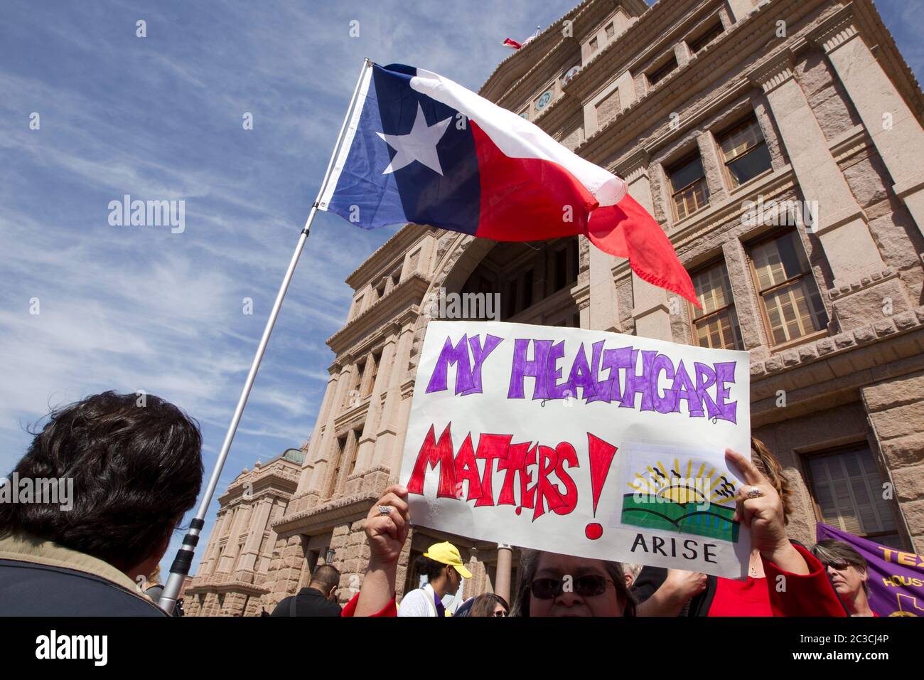 Austin, Texas USA, March 2013: Protesters at the Texas Capitol rally for increased Medicaid coverage after Gov. Rick Perry announced that the state will not accept any federal money to expand Medicaid in Texas. ©MKC/Bob Daemmrich Photography, Inc. Stock Photo