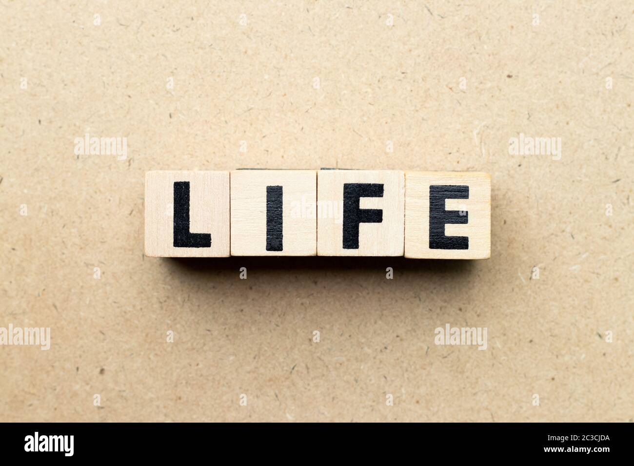 Alphabet letter block in word life on wood background Stock Photo - Alamy