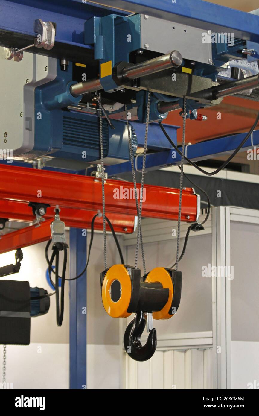 Overhead crane and hoist device mounted on a trolley at beam Stock