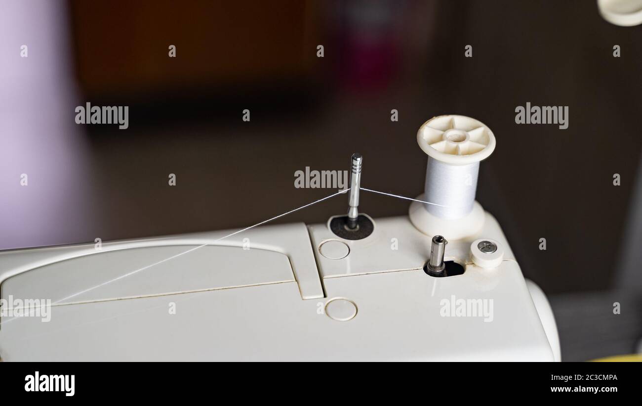 Electric sewing machine with fabric and thread Stock Photo - Alamy
