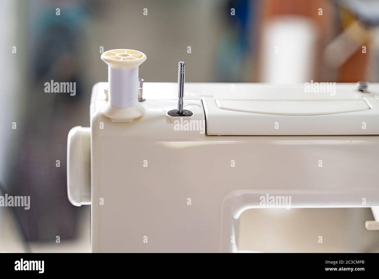 Electric sewing machine with fabric and thread Stock Photo Alamy