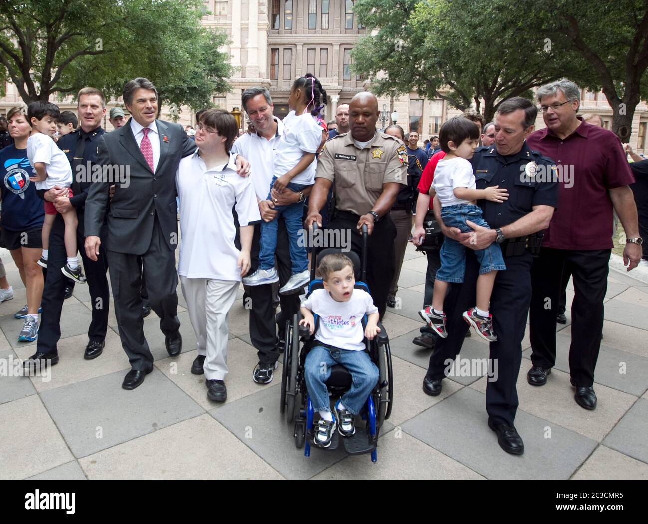 Austin Texas USA, Texas Gov. Rick Perry (fourth from left) walks with