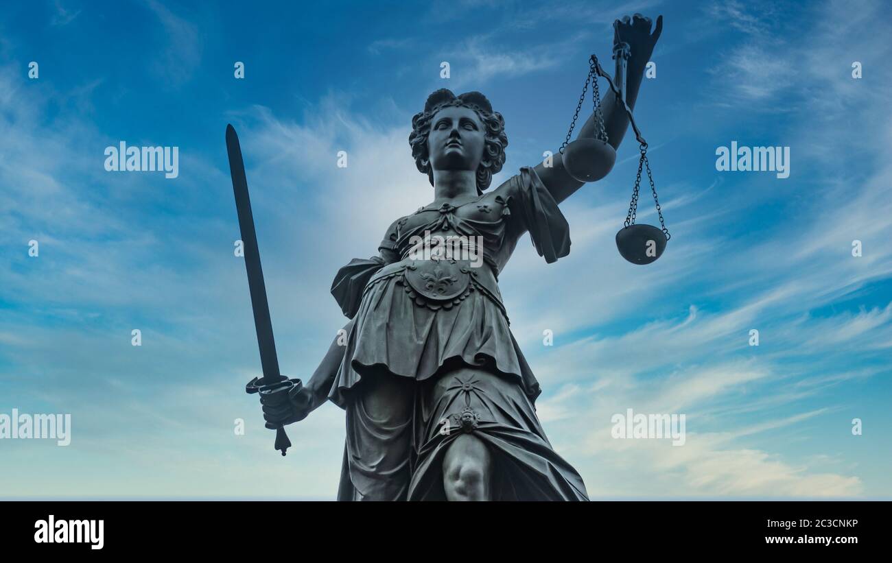 Justice Statue with sword and scale Stock Photo