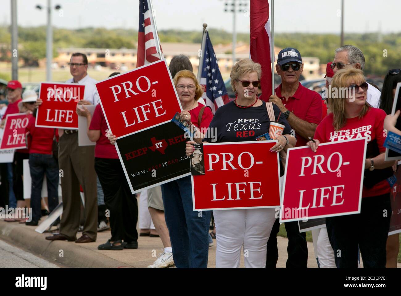 Group of pro-life, republican  citizens from Texas, rally with signs outside an event where  a pro-choice democrat female was announcing her intention to run for office.  mkc/BDP, Inc. Stock Photo