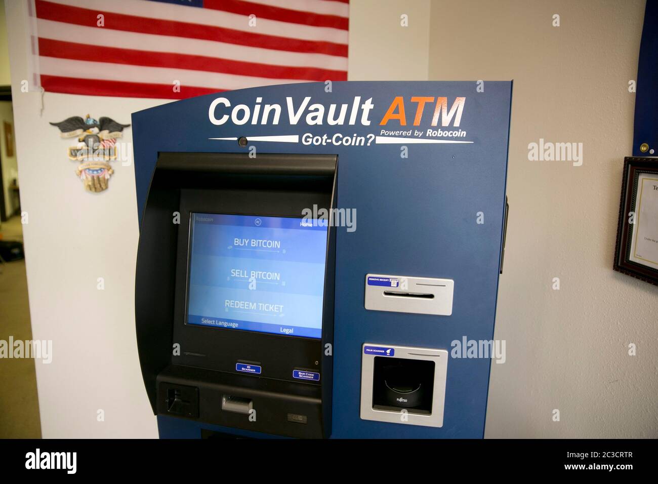 Austin Texas USA, March 5, 2014:  Bitcoin ATM machine located inside Central Texas Gun Works. Bitcoin was  launched in 2009 and is a decentralized digital currency that is traded mostly online and person to person rather than through banks. The Austin ATM is the first of its kind in the USA to dispense cash.   ©Marjorie Kamys Cotera/Daemmrich Photography Stock Photo
