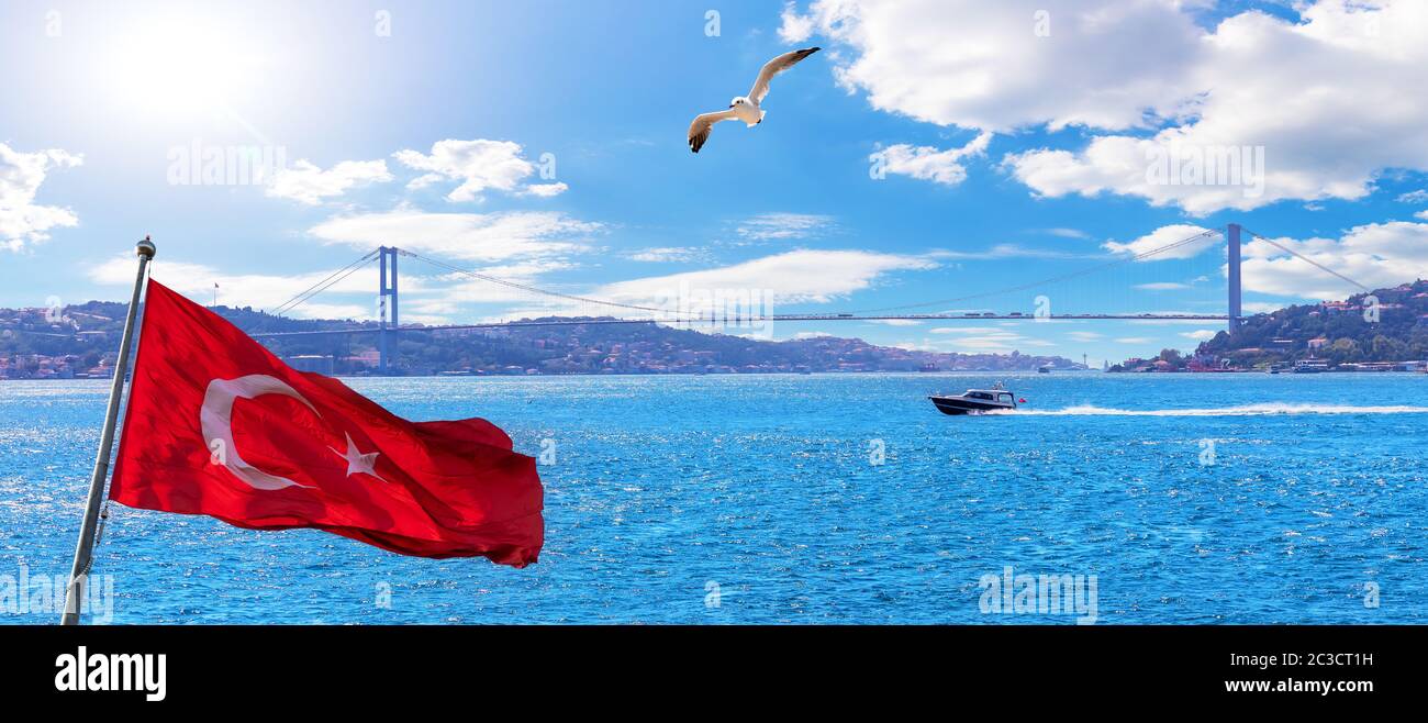 Bosporus, Turkish flag and the Bosphorus Bridge, Istanbul panorama. Stock Photo