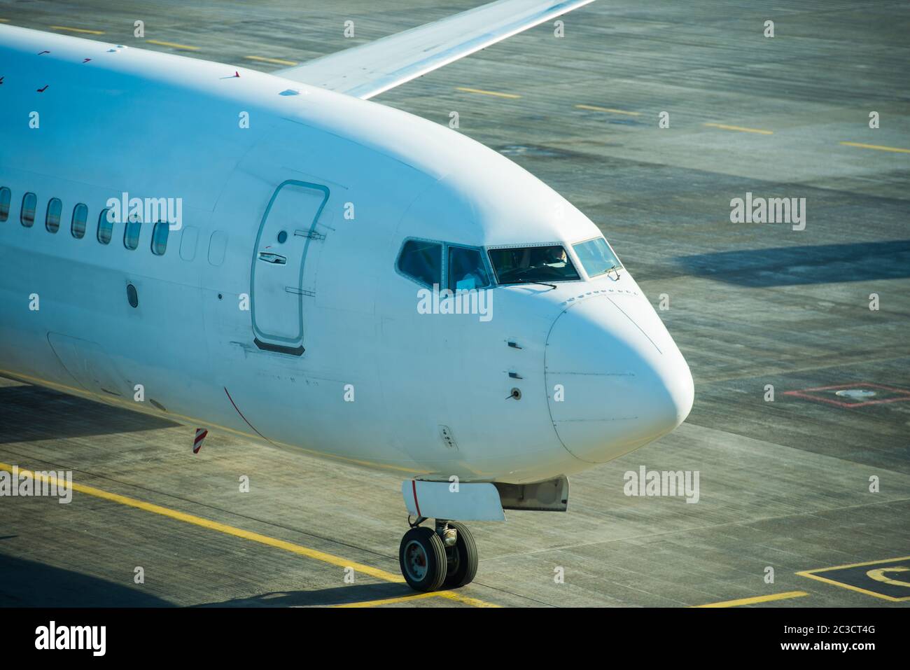 Plane standing on runway Stock Photo