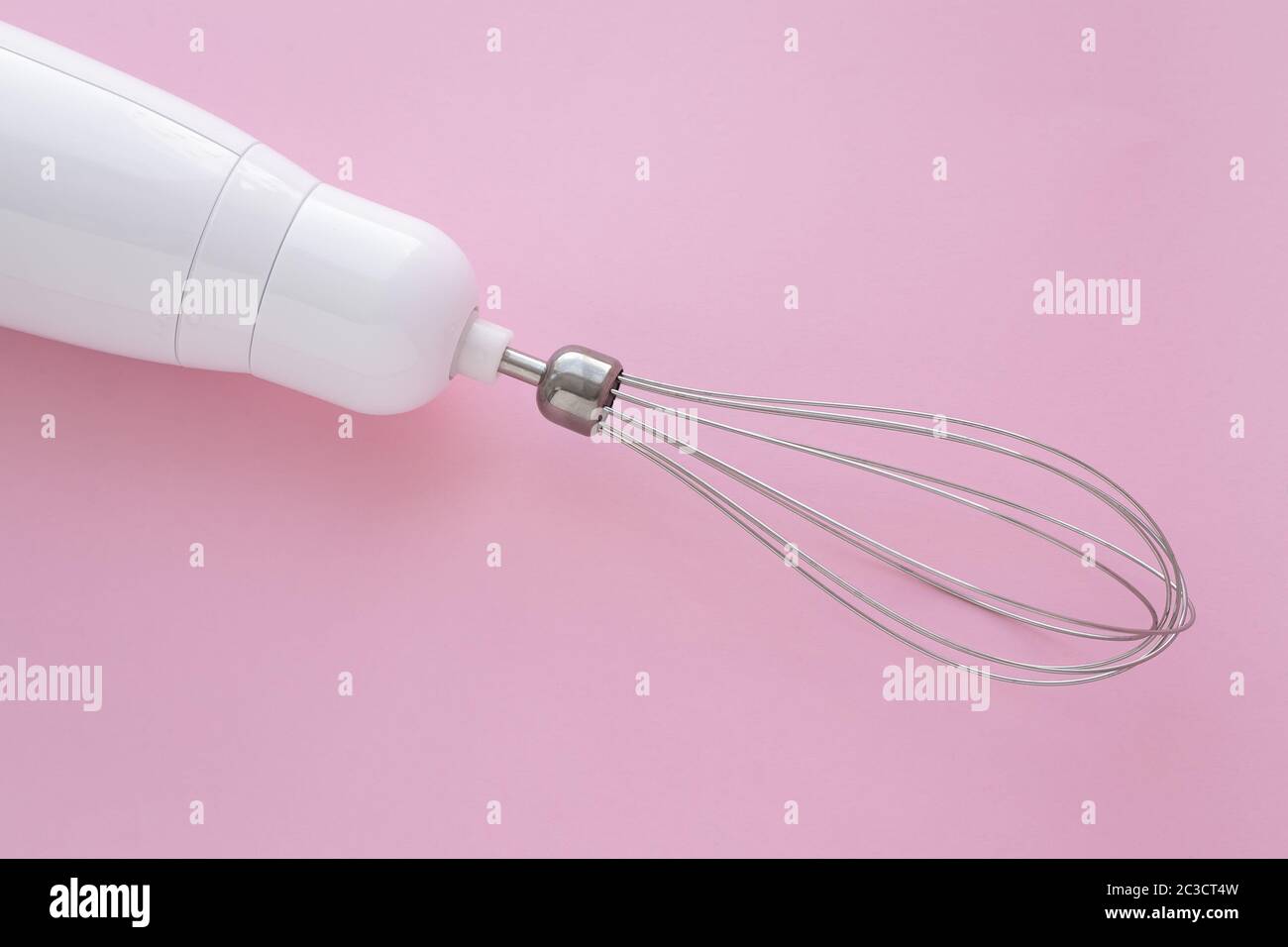 Electric blender with a whisk for mixing eggs. The mixer is used to make cream Stock Photo