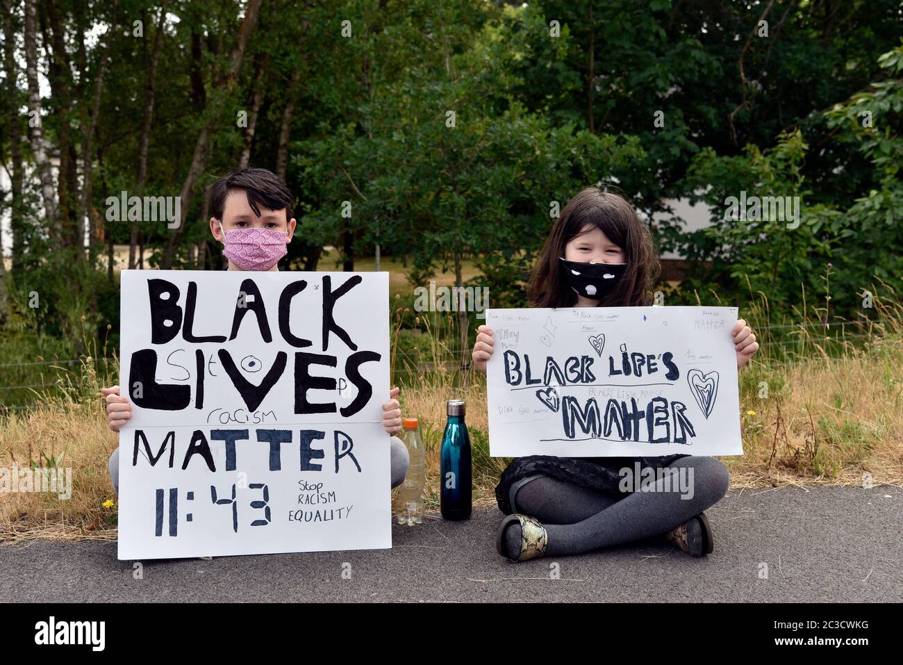 Black Lives Matter: People protesting in the wake of the police killing of George Floyd (14 October 1973-25 May 2020) in USA, Bordon, Hampshire, UK. Stock Photo