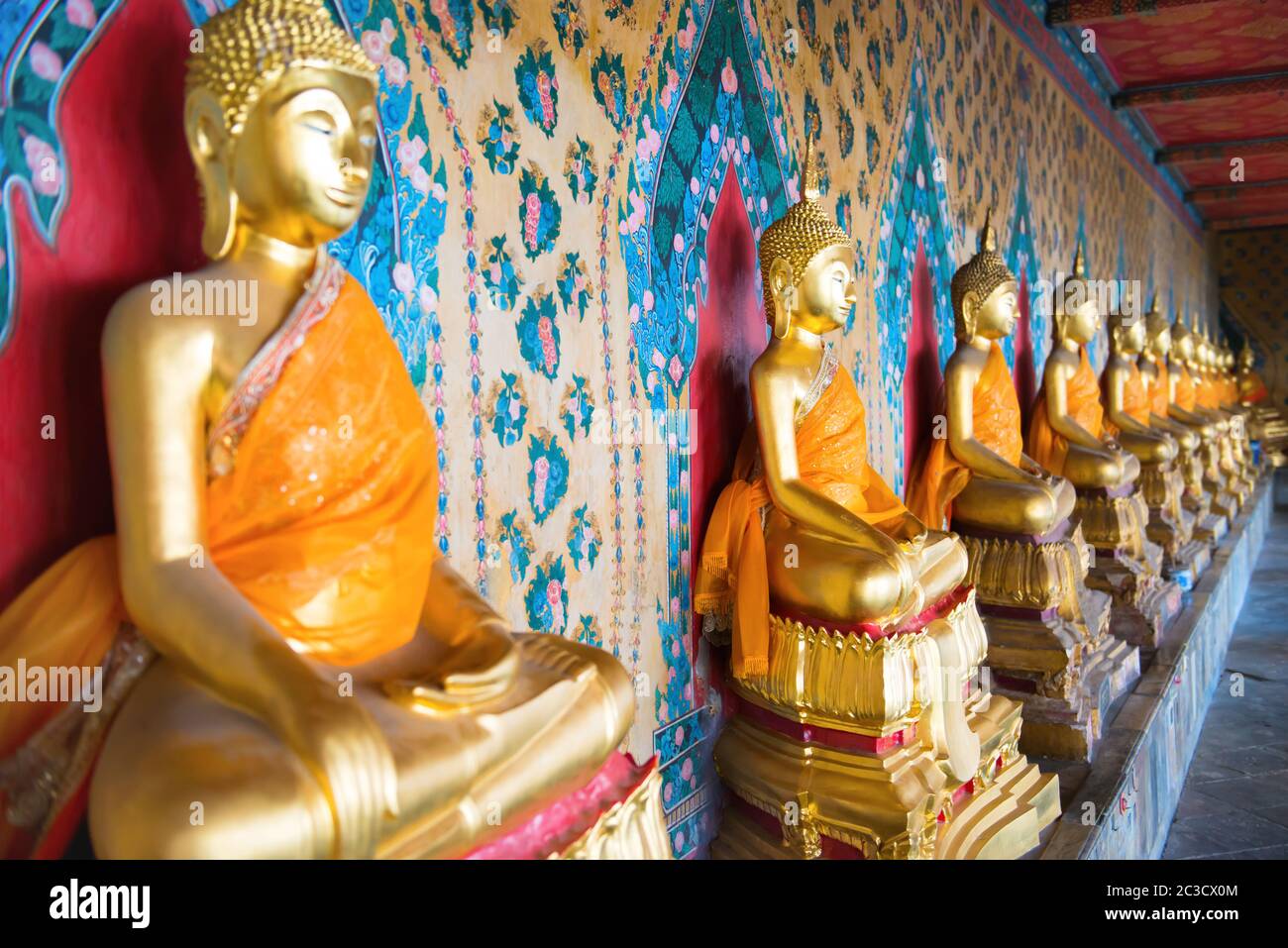 View of row gold statues of sitting buddhas Stock Photo
