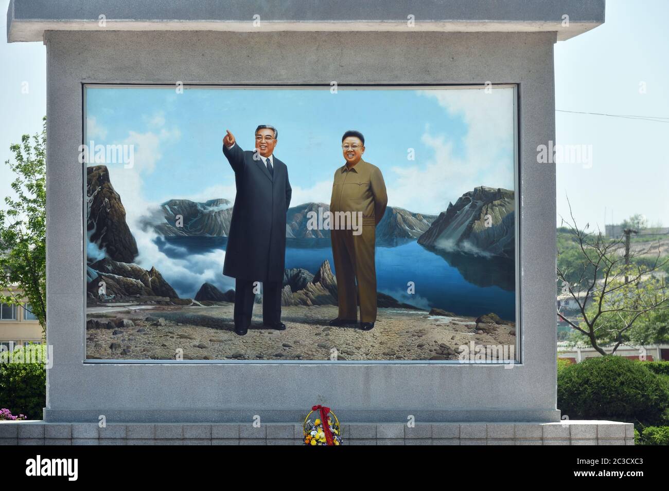 Kaesong, North Korea - May 5, 2019: Propaganda panel with portraits of former leaders  Kim Il Sung and  Kim Jong Il on the city street Stock Photo