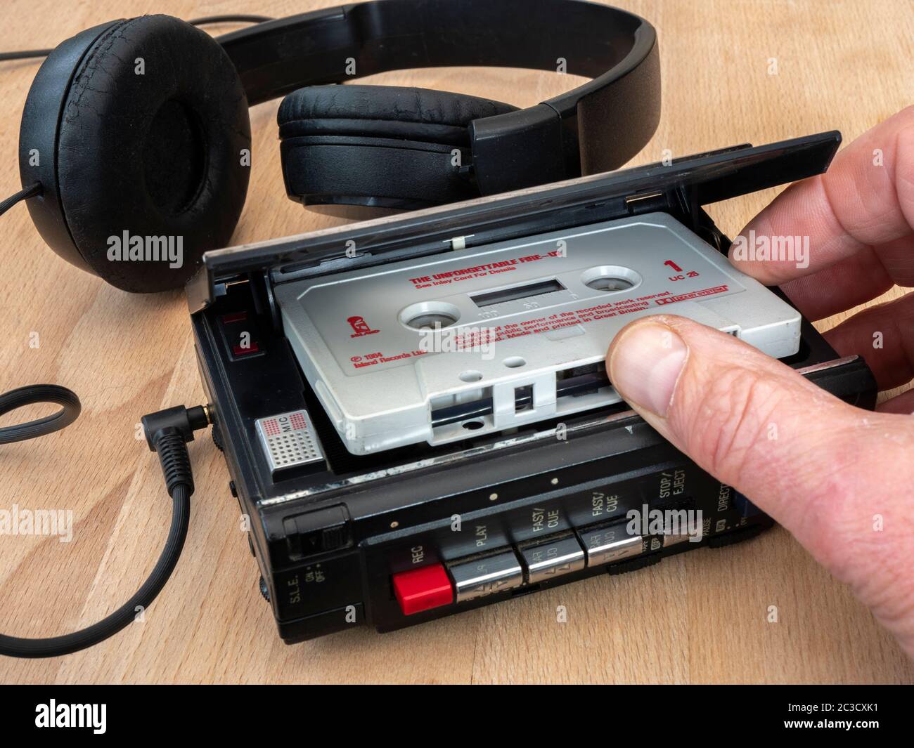 Fingers on a 1984 audio cassette tape U2 The fire in