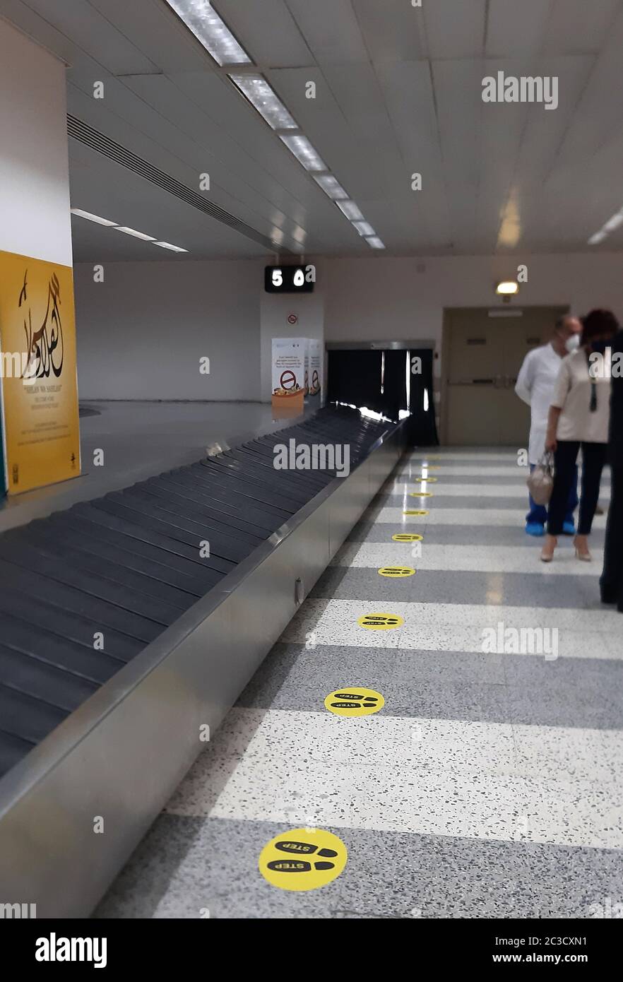 Beirut. 19th June, 2020. Photo taken on June 19, 2020 shows signs on the ground reminding people of social distancing at Beirut Rafic Hariri International Airport in Beirut, Lebanon. The airport is expected to reopen on July 1. Credit: Bilal Jawich/Xinhua/Alamy Live News Stock Photo