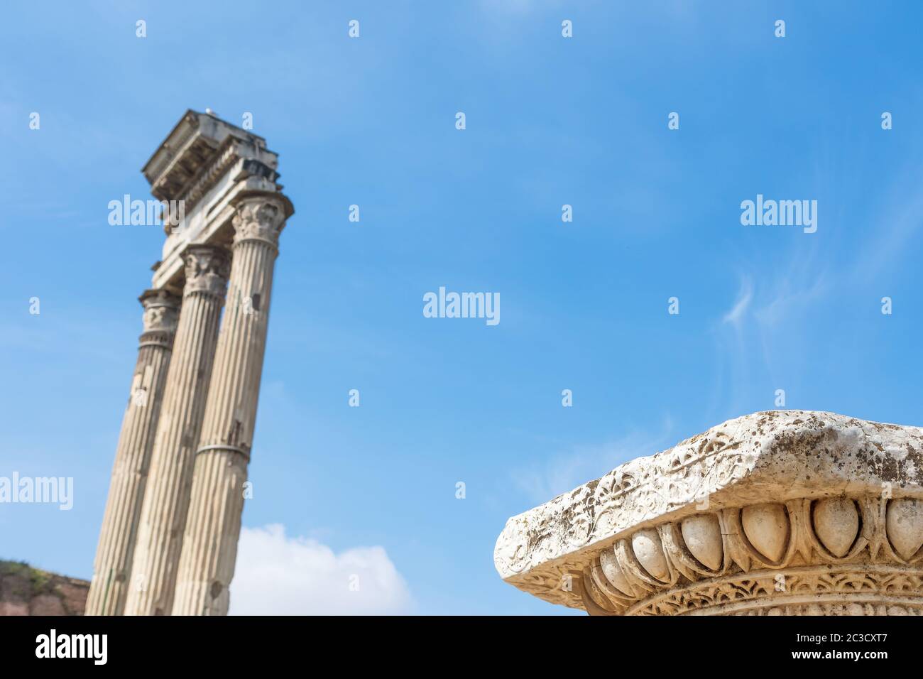 Decoration of columns of ruins in Forum Romanum. Iconic three columns ...