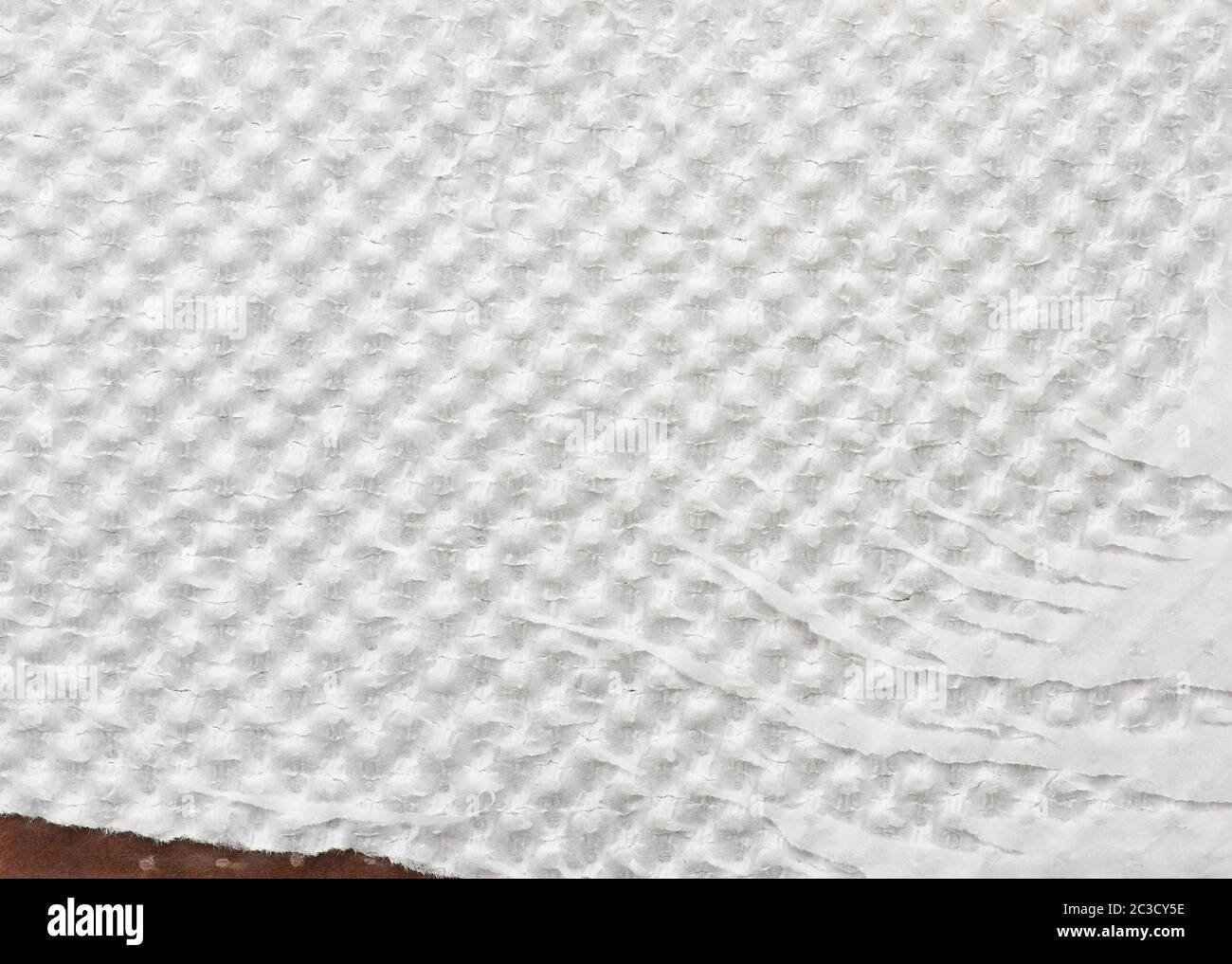 fragment of white tattered wrapping paper, full frame, close up Stock Photo
