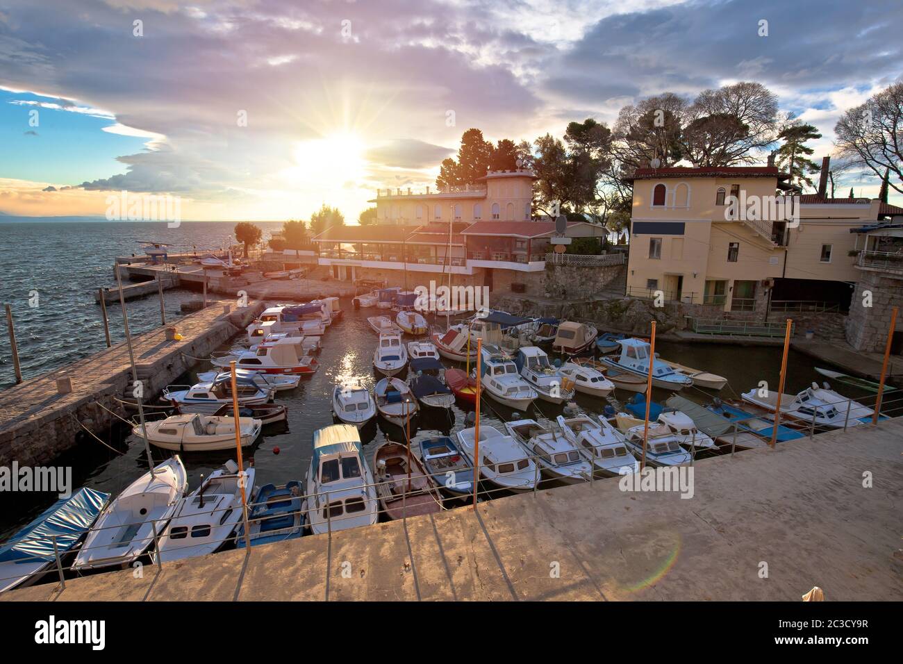 Town of Lovran waterfront and harbor sunset view Stock Photo