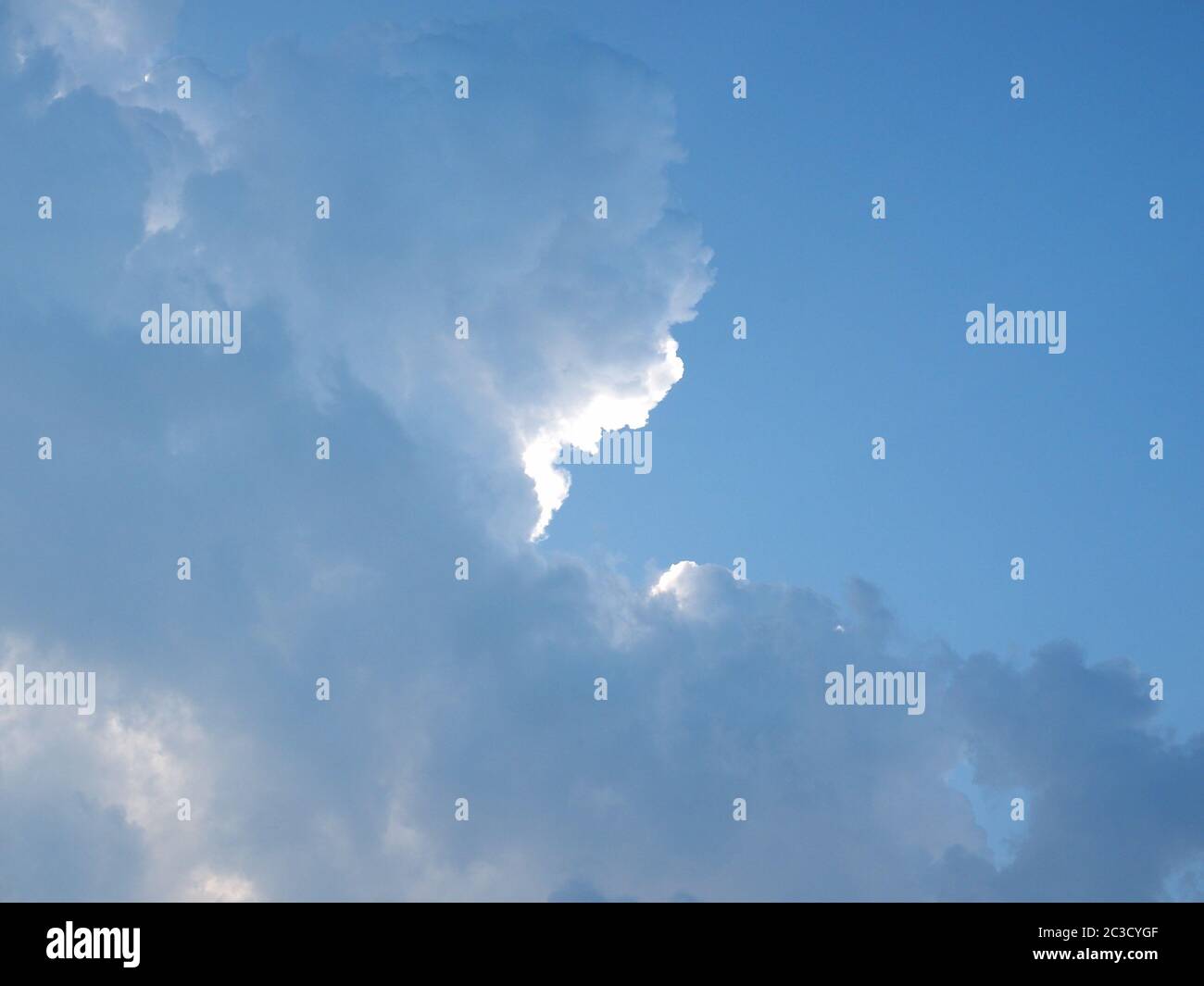 blue sky with clouds useful as a background Stock Photo - Alamy
