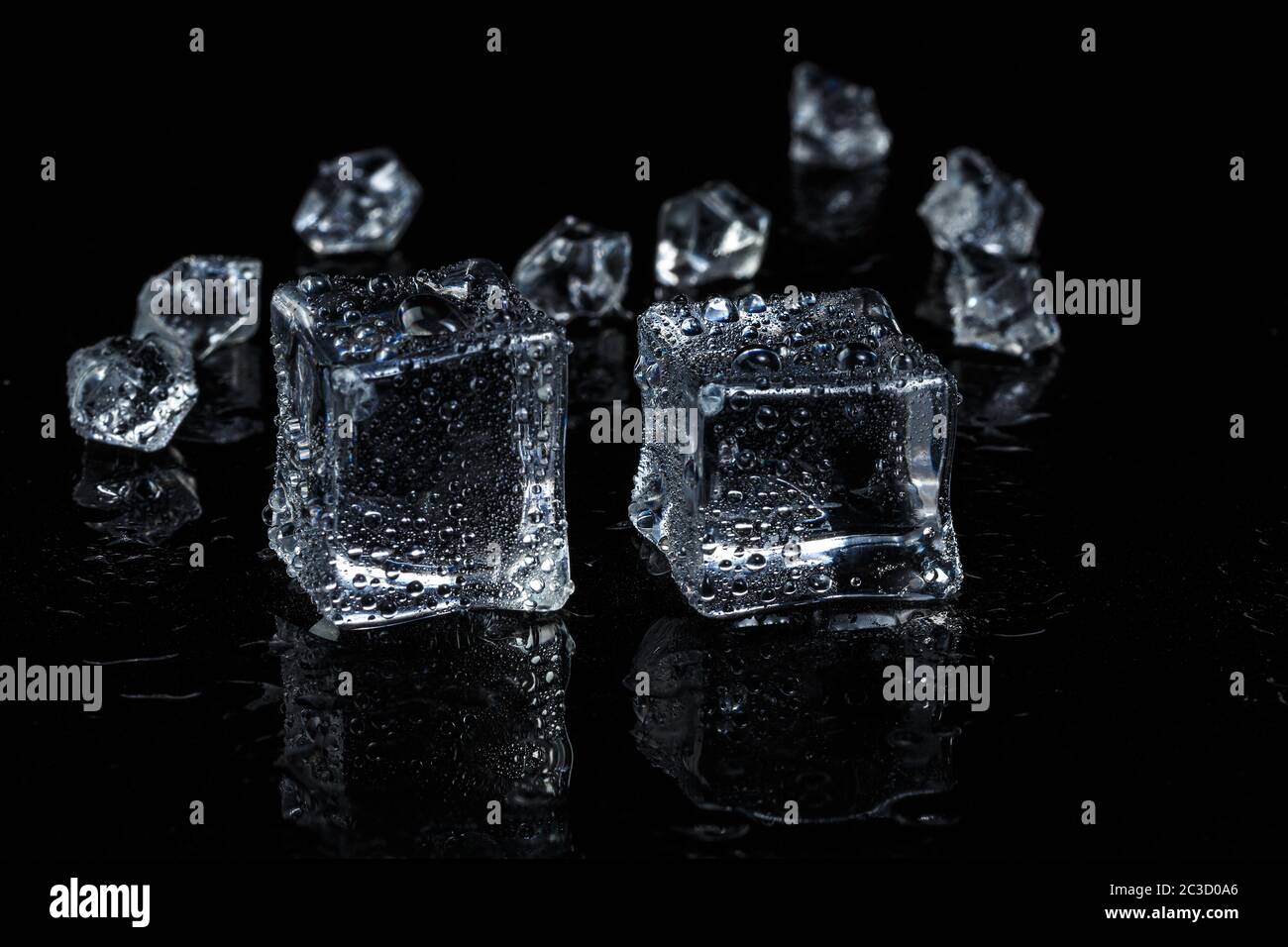 ice cubes on black isolated glass background Stock Photo