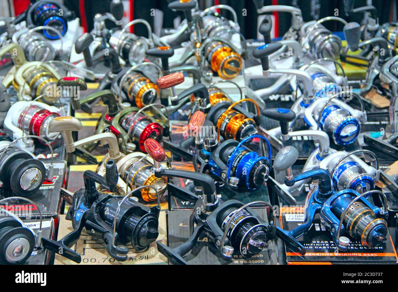 Fishing reels presented at exhibition in Kiyv. Wide assortment of goods for fishing. exhibition of g Stock Photo