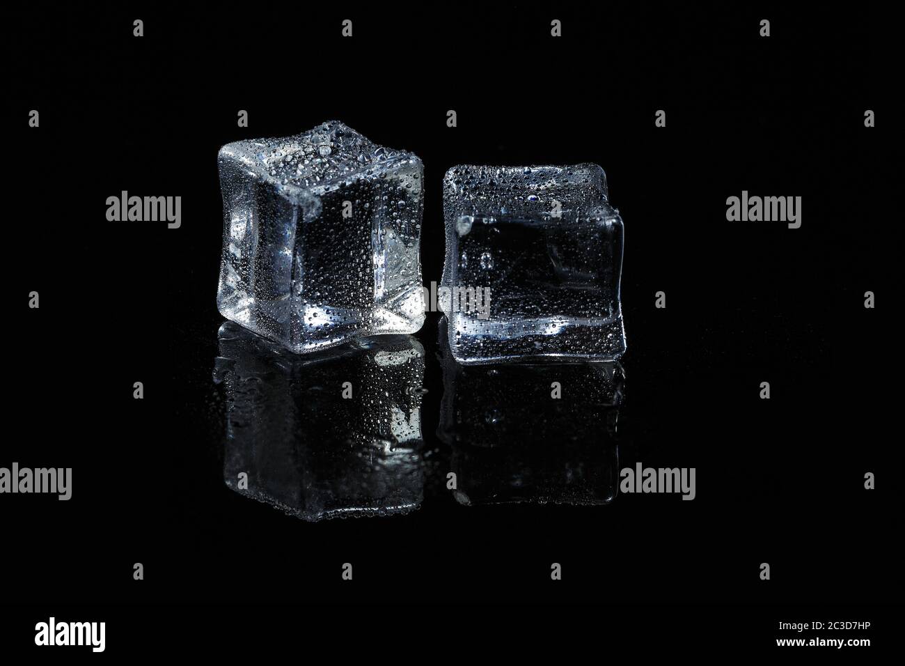ice cubes on black isolated glass background Stock Photo
