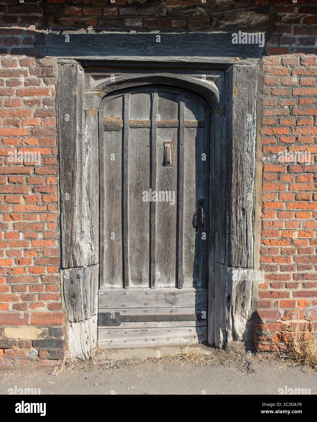 Old wooden door of an old house in a small village in Kent,UK Stock Photo