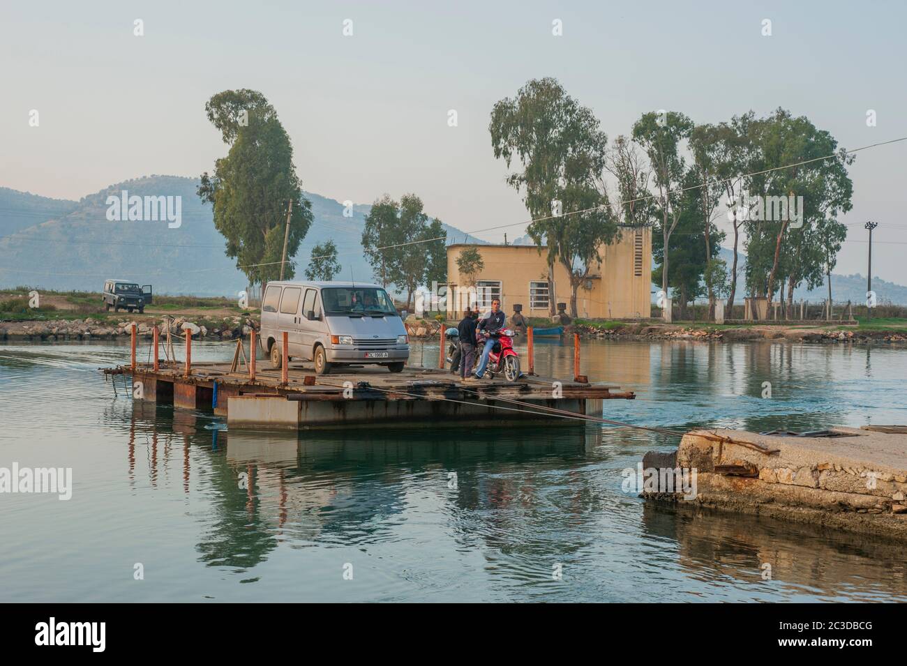 A ferry over a small river in Butrint near Saranda, is a coastal town ...