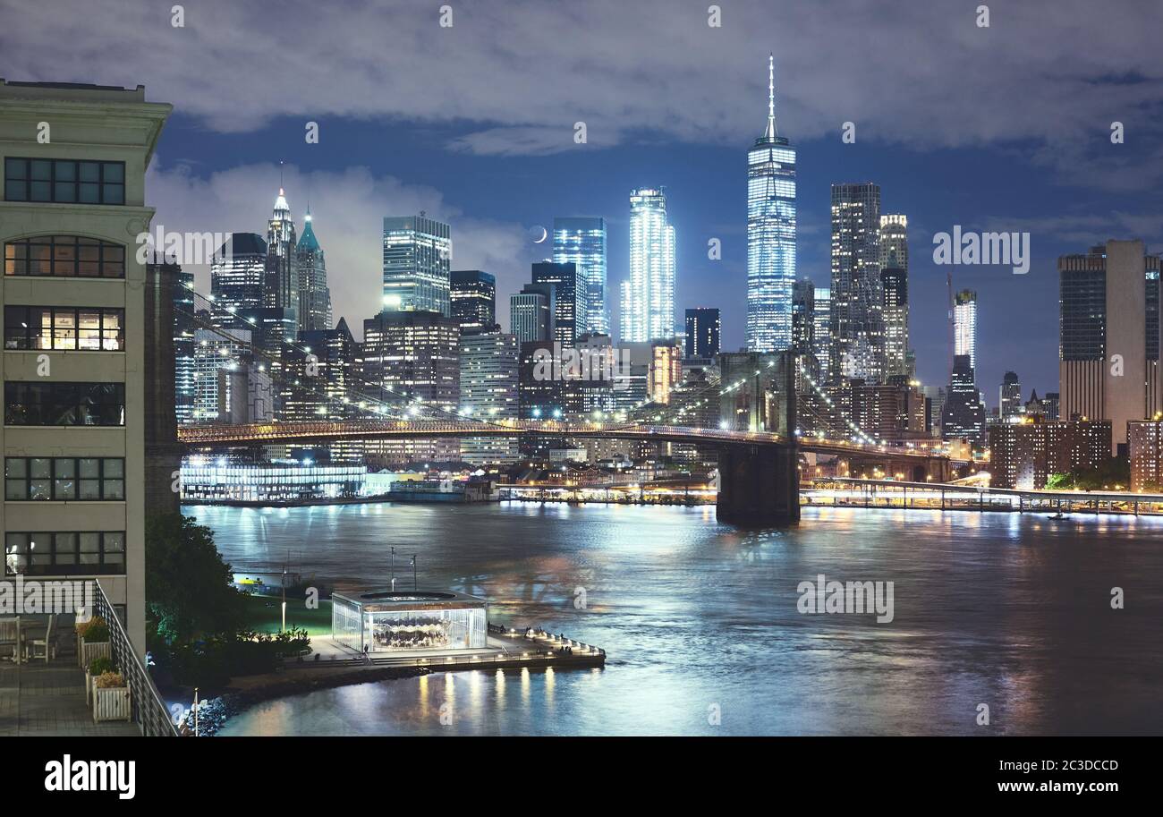 New York cityscape at night, Brooklyn Bridge and Manhattan seen from Brooklyn Dumbo, color toning applied, USA. Stock Photo