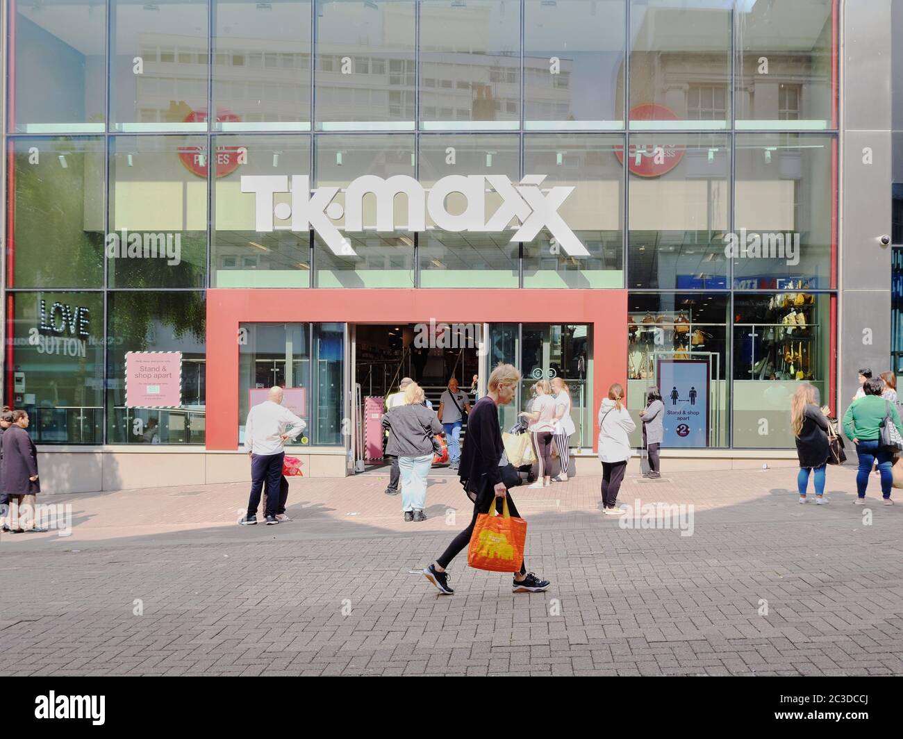 Shoppers queue outside TK Maxx on the first day non-essential shops were permitted to reopen after relaxation of coronavirus restrictions in the UK. Stock Photo