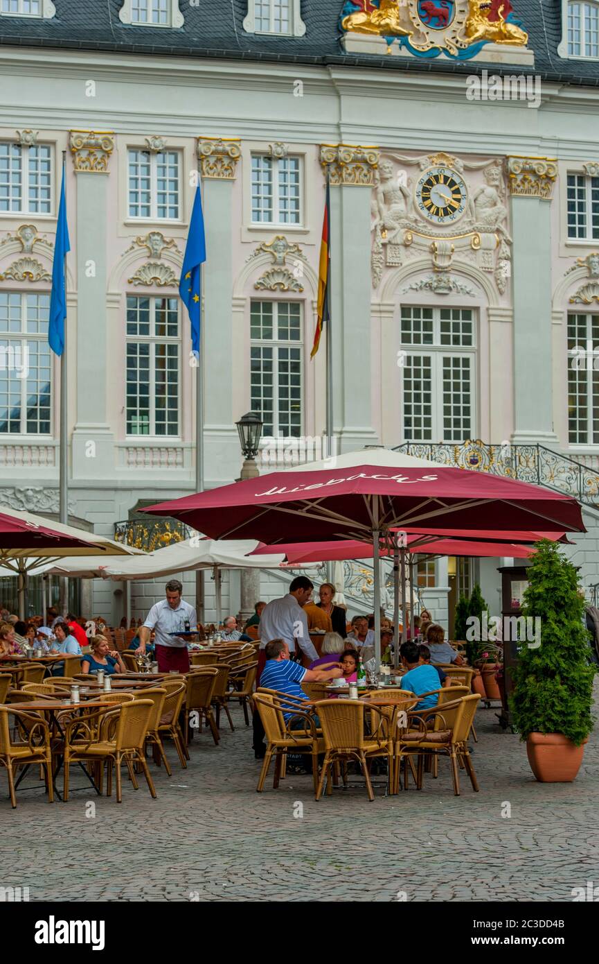 A sidewalk cafe in front of historic town hall (Rococo style) on the market square in Bonn, Germany. Stock Photo