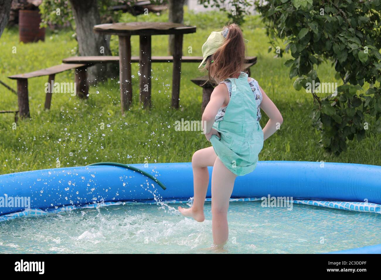 beautiful dark hair little girl dance in swimming pool Stock Photo Alamy